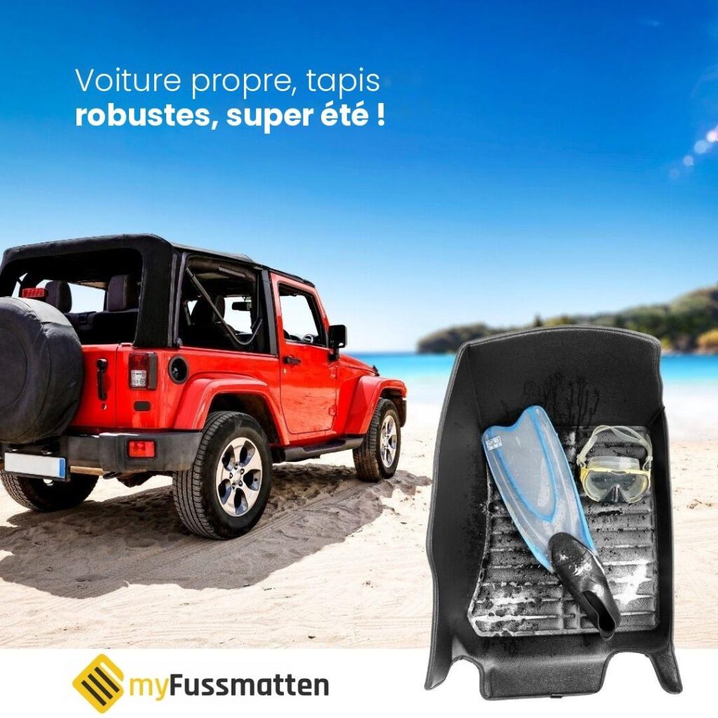 Tout-terrain rouge sur une plage de sable à côté d’un tapis de sol 5D avec palmes et masque de plongée