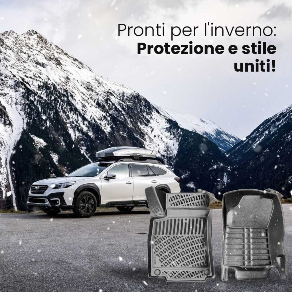SUV bianco con box da tetto tra le montagne innevate accanto a due tappetini auto neri